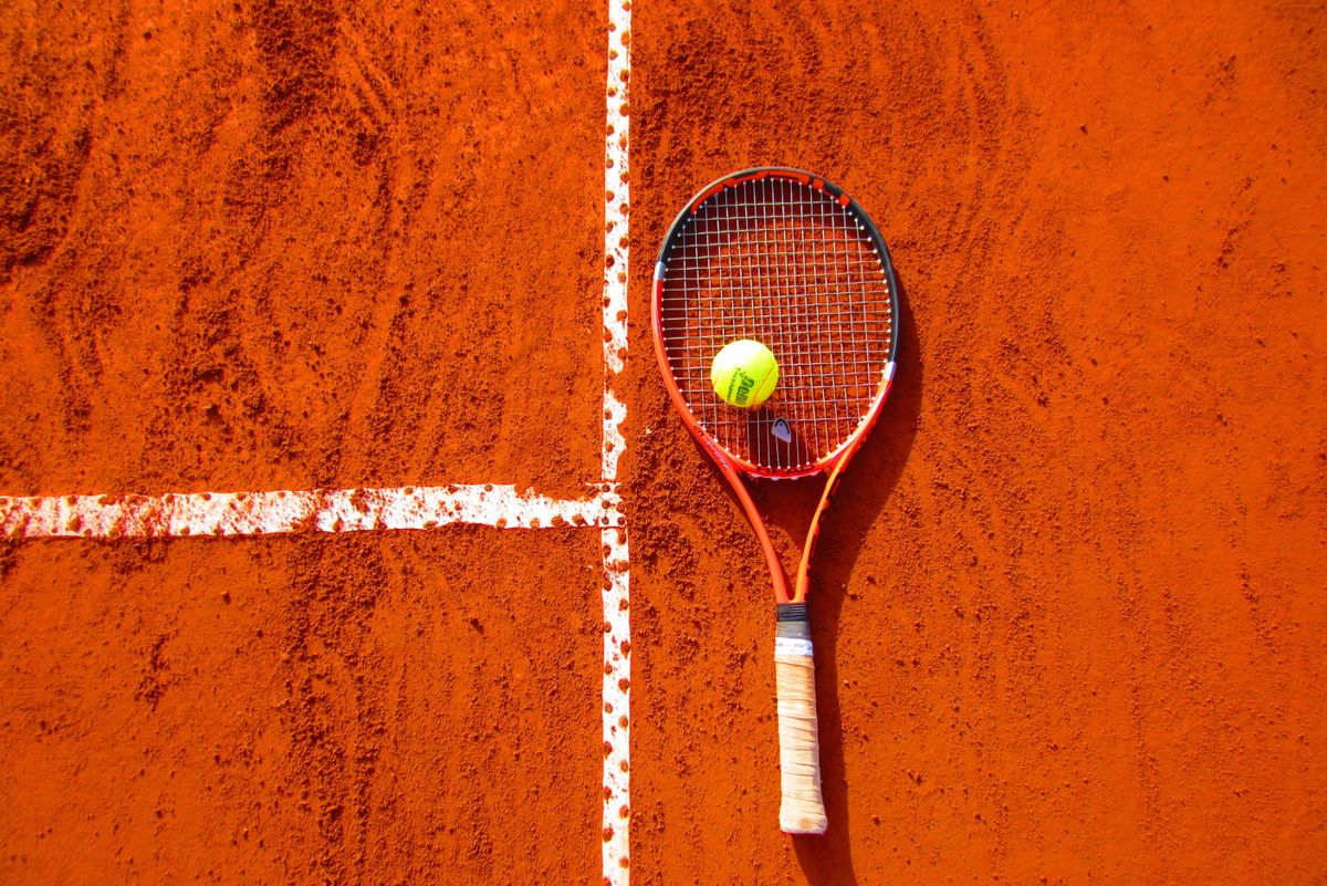 Aerial view of Roland Garros tennis complex in Paris showing the famous clay courts and Philippe Chatrier Center Court where the French Open 2027 will be held